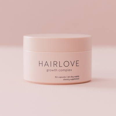 Pink matte jar labeled HAIRLOVE growth complex — 60 capsules | 30 day supply dietary supplement